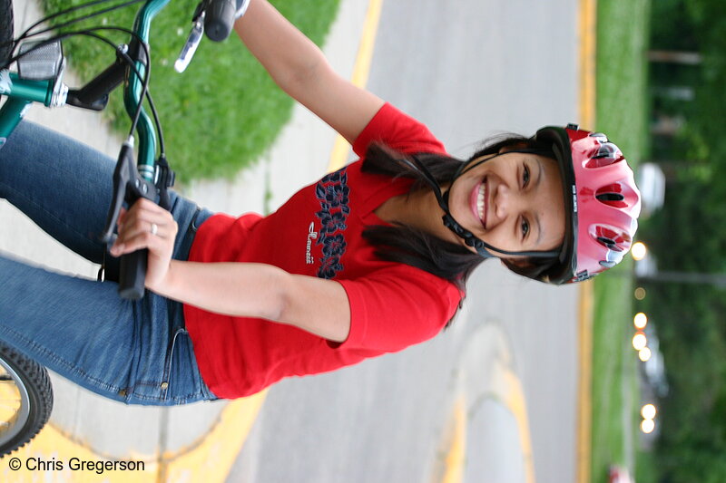 Photo of Young Woman Smiling on a Bicycle (at Rest)(4647)