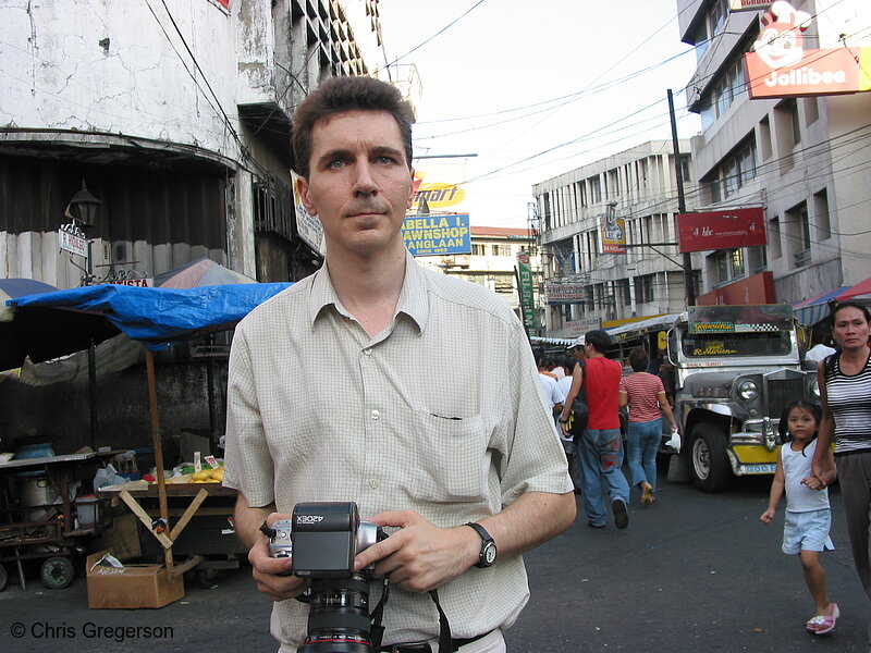 Photo of A Foreign Photographer Searches for the a Good Shot in Quiapo(5497)