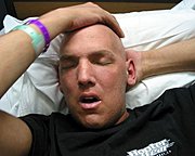 Marc in the Hospital Holding his Head