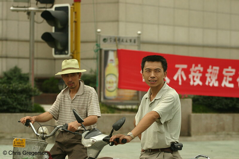 Photo of Men on Scooters, Waiting at an Intersection(3267)