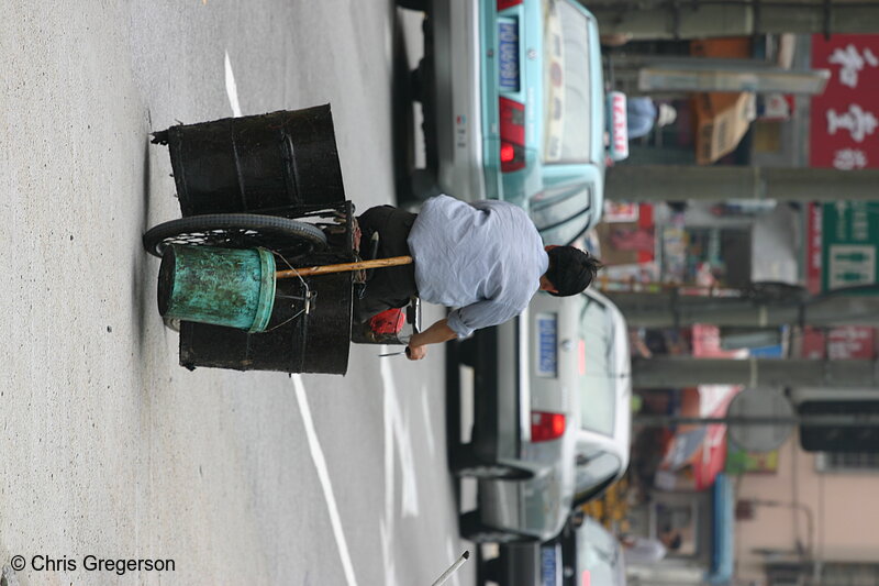 Photo of Man Hauling Steel Drums by Bicycle(3407)