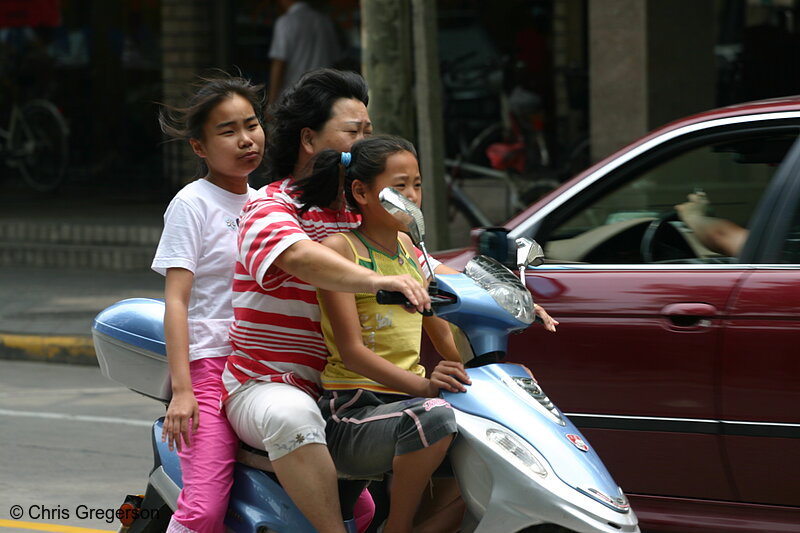 Photo of Woman on a Moped with Girls, Shanghai(3409)