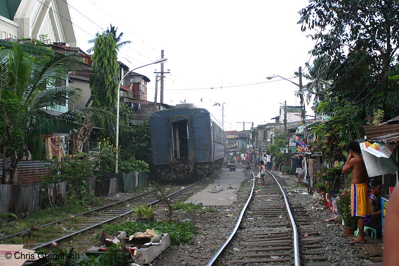 Photo of Train Rumbling Through Manila Neighborhood(4606)