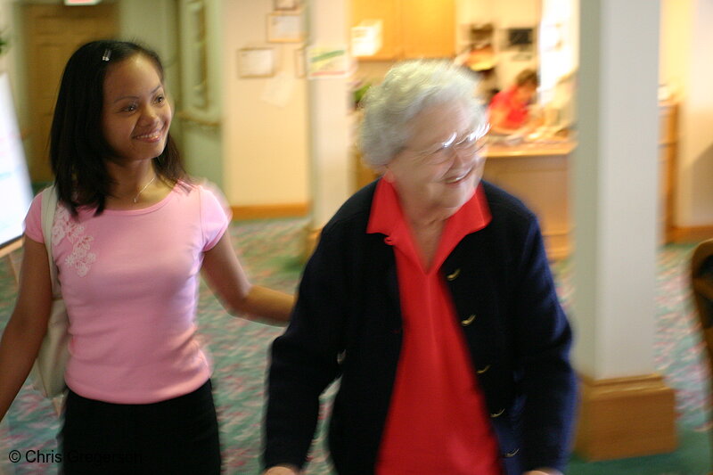 Elderly Woman and Young Asian Relative