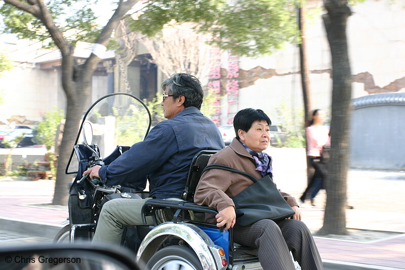 Photo of Old Chinese Couple on Motorized Cart(5168)