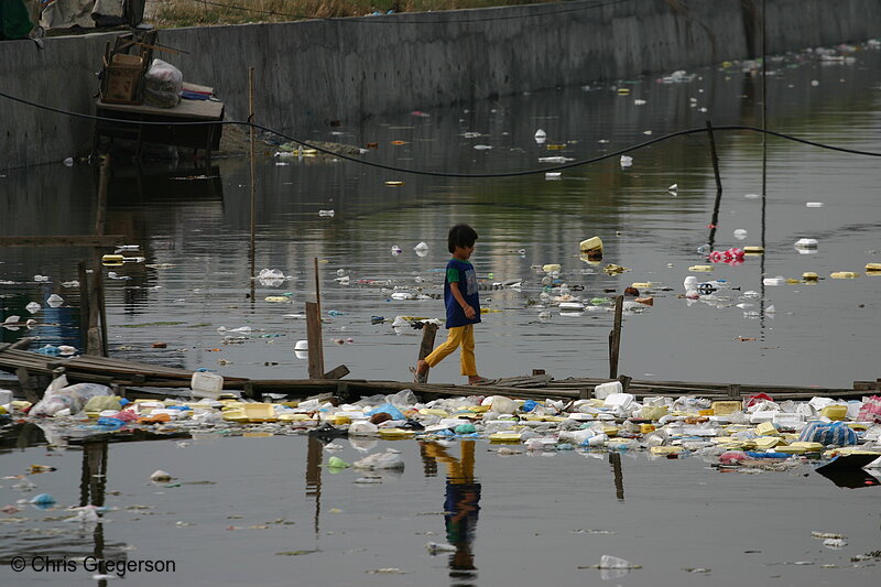 Photo of Boy Crossing a Polluted River in Baclaran, Manila(5225)