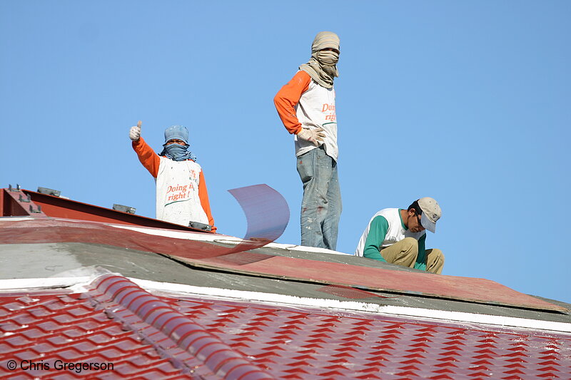 Photo of Three Men Laying the Brick Roofing of a Building, One Doing a Thumbs Up Gesture(5280)