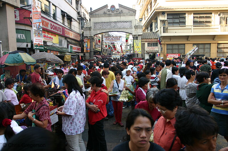 Photo of A Sampaguita and Ilang-Ilang Vendor in the Teeming Courtyard of Quiapo Church(5503)