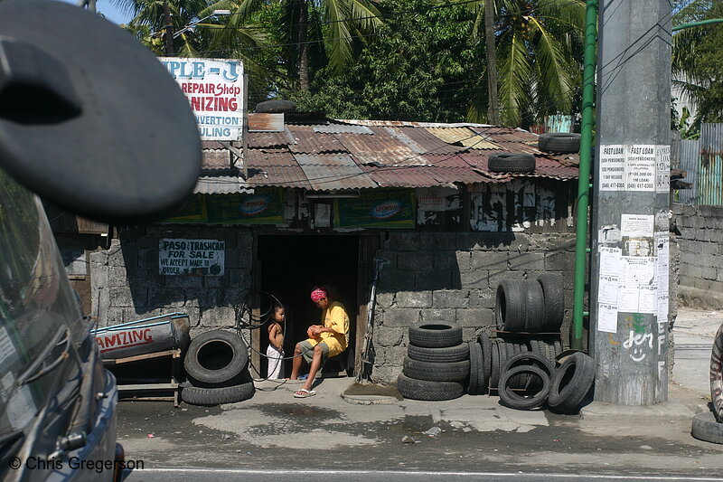 Photo of Adult and Small Child, Vulcanizing and Repair Shop in Imus, Cavite(5537)