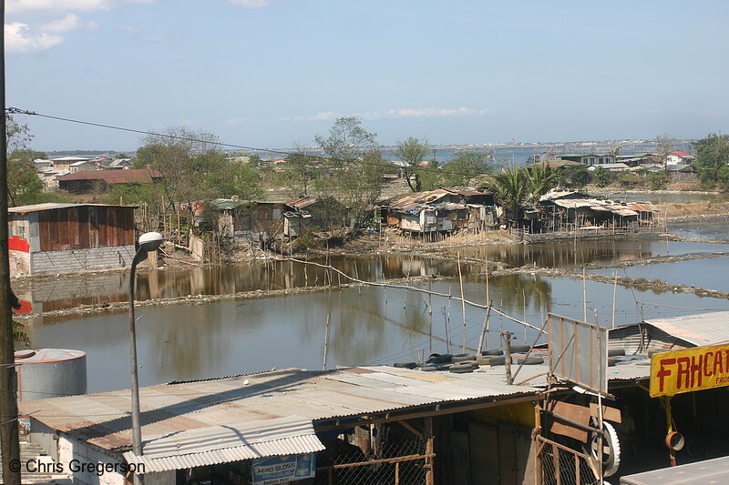Photo of Shabby Houses Near a Fish Pond in Cavite(5539)