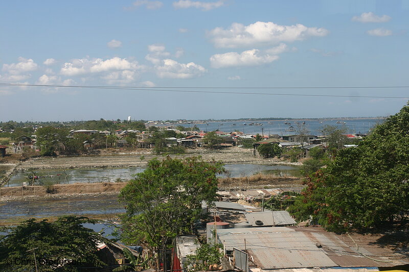 Photo of Shabby Houses Near a Fish Pond in Cavite(5540)