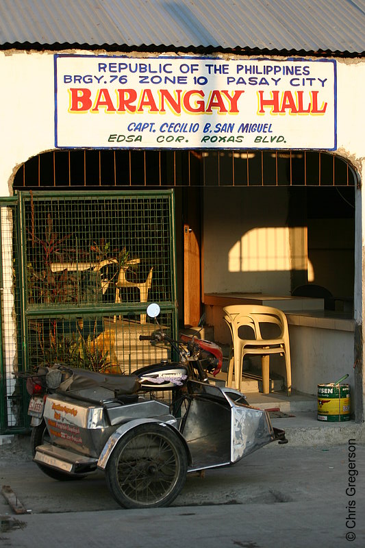 Photo of Tricycle Parked In Front of a Barangay Hall(5583)