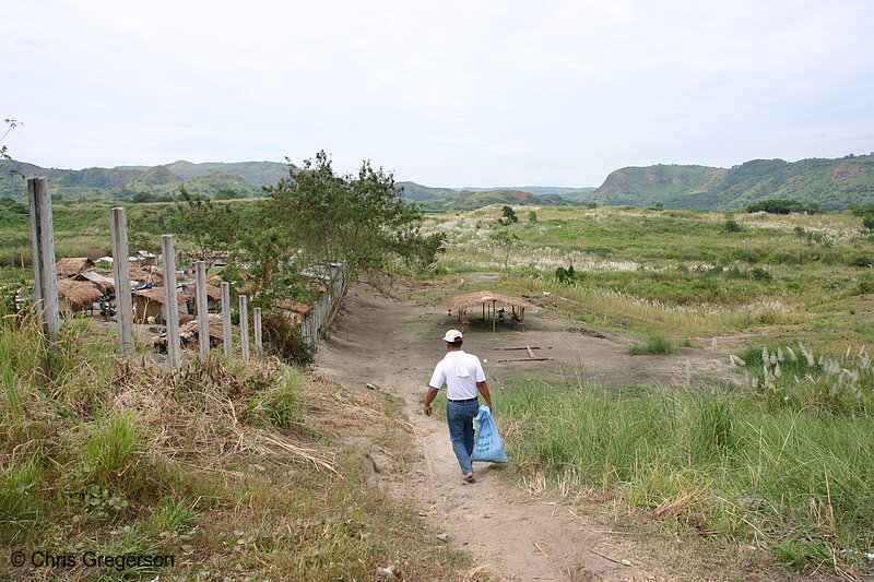 Photo of Man Carrying a Sack of Rice to Aeta Village in Pampanga(5981)