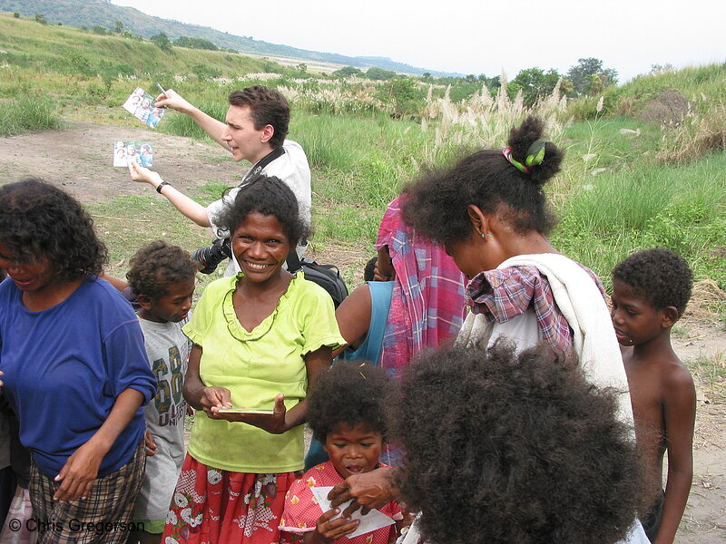 Photo of Chris Handing Out Photos in Aeta Settlement Village, Pampanga(6001)