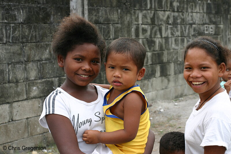 Photo of Young Aeta Girl Holding Brother(6022)