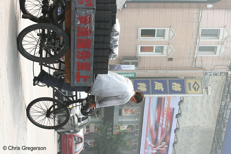 Photo of Old Chinese Man Driving Cart with Coal Cylinders(6038)