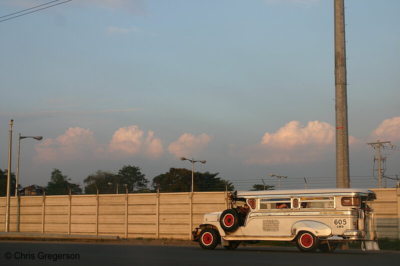 Photo of Jeepney Traveling on Empty Street in Manila(6167)