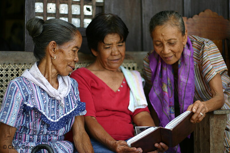 Photo of Three Filipina Women Looking at Photos(6330)