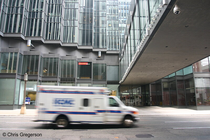 Photo of HCMC Ambulance Speeds Past the IDS Tower(6464)