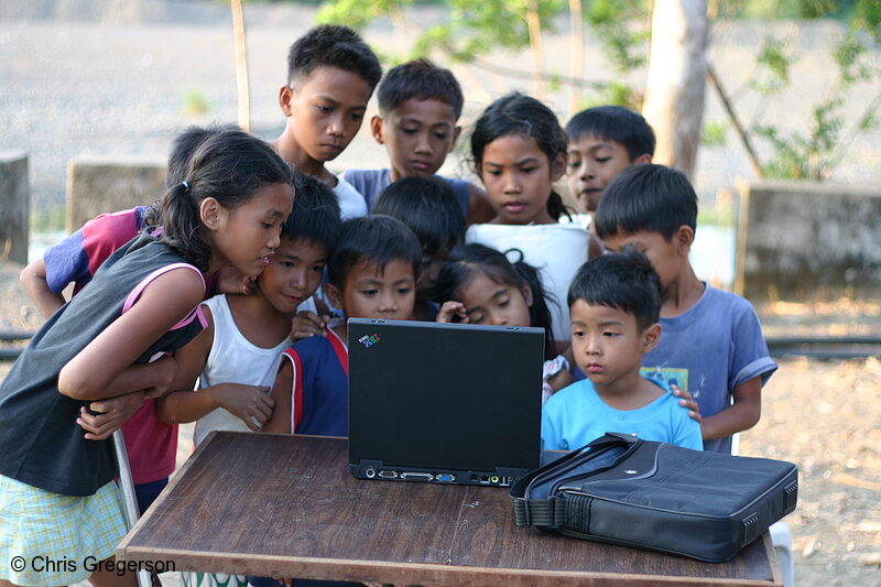 Photo of Children Gathered Around a Laptop Computer in the rural Philippines(6707)