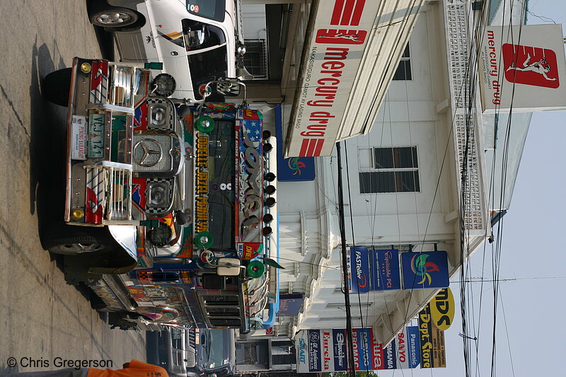 Photo of Jeepney Passing Mercury Drug, Vigan(7508)