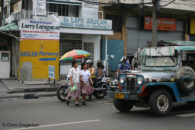 Photo of Students Crossing in front of a Jeepney(7744)