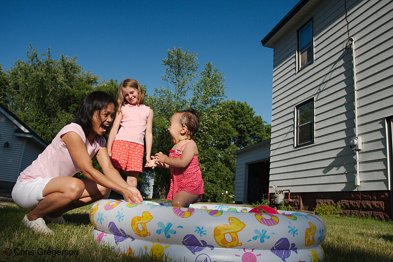 Toddler Playing in a Wading Pool