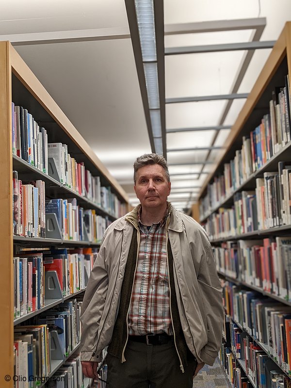 Photo of Chris Standing in a Library(8420)