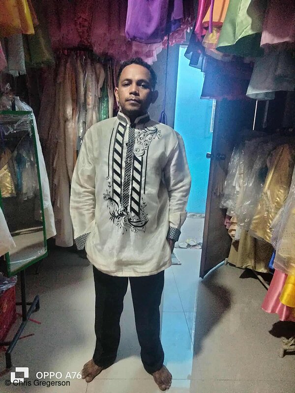 Aljon trying a Barong